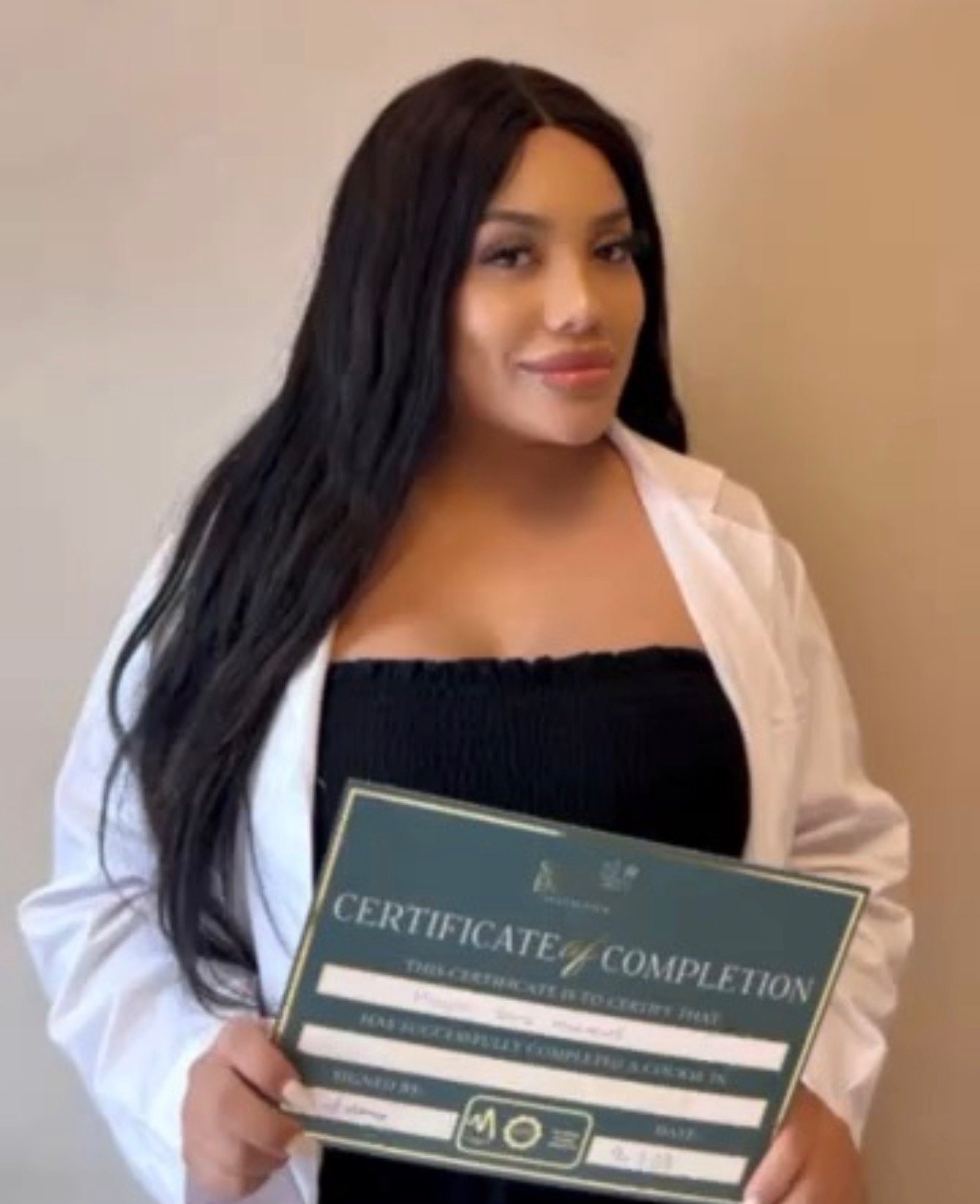 Simply Enhanced Academy graduate with certificates